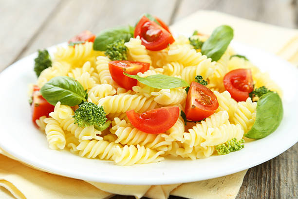 istock Delicious pasta on plate on grey wooden background 474366712