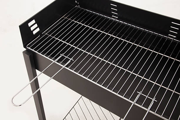 istock New and empty barbecue grill on white 474369194
