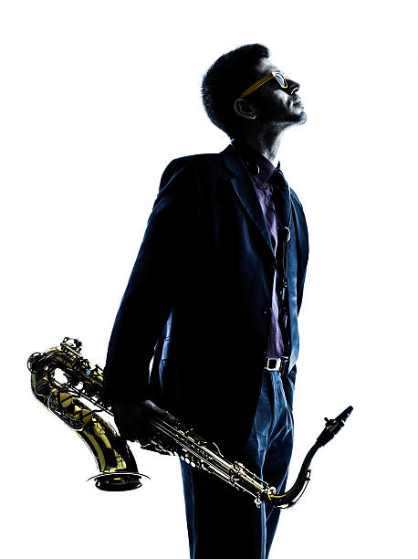 istock man saxophonist playing saxophone player  silhouette 474369612