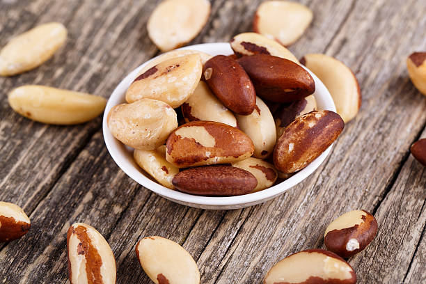 istock Brazil nuts on a plate on wooden background. 474370664