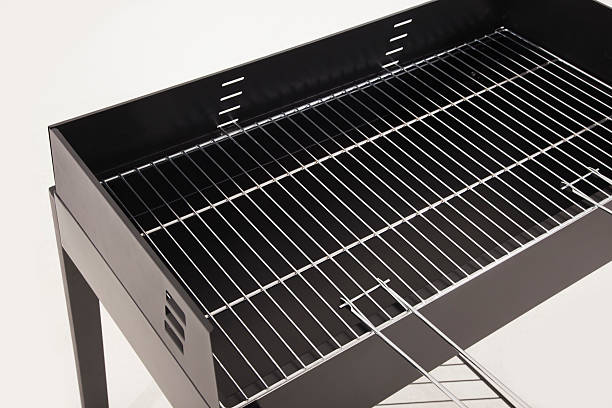 istock New and empty barbecue grill on white 474370734