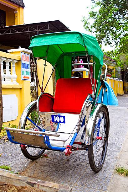 istock Unidentified service cyclo rider passing an ancient house 474374022