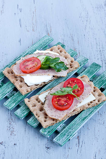 istock crisp bread with cheese and smoked turkey meat 474377436