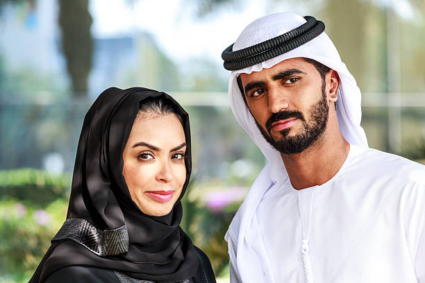 istock An arab couple are talking in a park. 474390842