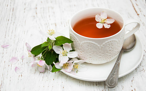 istock Cup of tea and spring blossom 474394132
