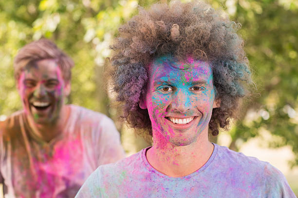 istock Happy friends covered in powder paint 474394406