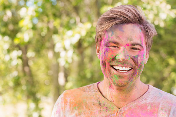 istock Happy man covered in powder paint 474394466