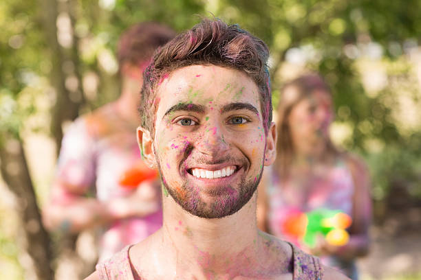 istock Happy boy covered in powder paint 474394538