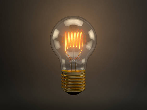 istock Vintage light bulb with glowing filament over dark background 474398821