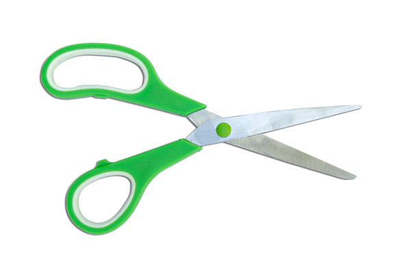 istock Green scissor isolated on white 474399192