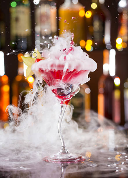 istock Cocktail with ice vapor and splashing liquid 474399602