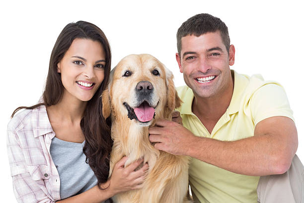 istock Happy loving couple stroking dog 474403210