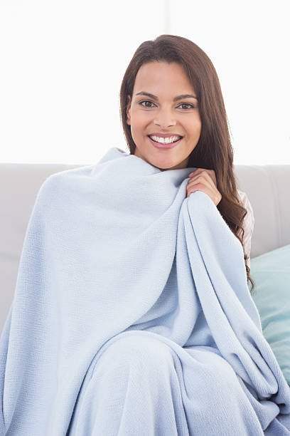 istock Beautiful woman wrapped with blanket 474403458