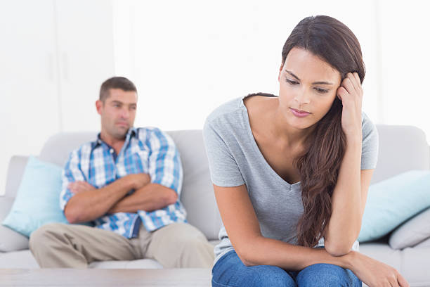 istock Angry woman sitting in front of man 474403630