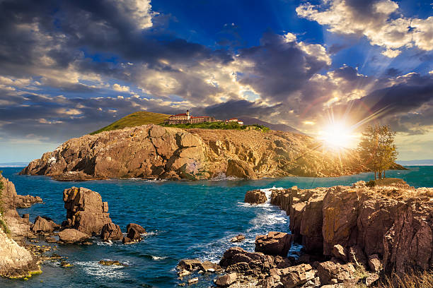 istock composite island with hills and castle at sunset 474403768