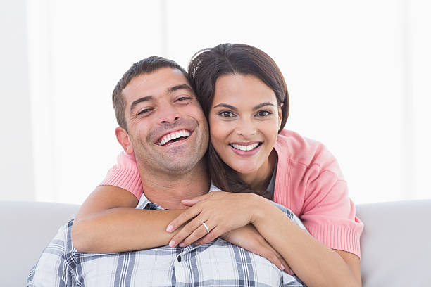 istock Happy young woman embracing man 474405436