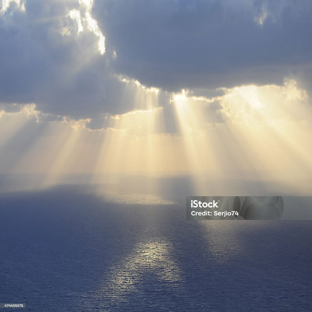 Clouds and rays of sun. Clouds and rays of sun above the sea. Cloud - Sky Stock Photo