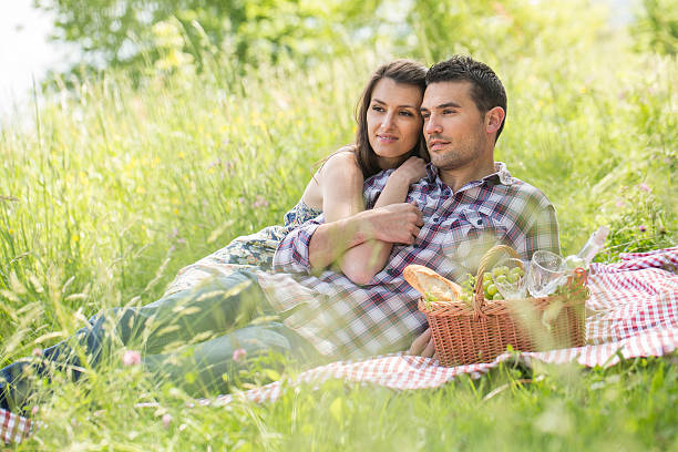 istock happy couple having a picnic in summer 474406382