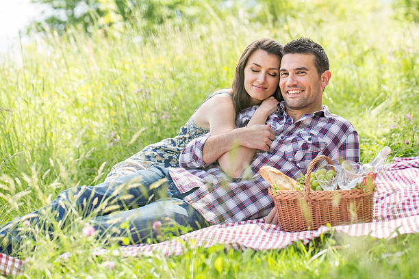 istock happy couple having a picnic in summer 474406438