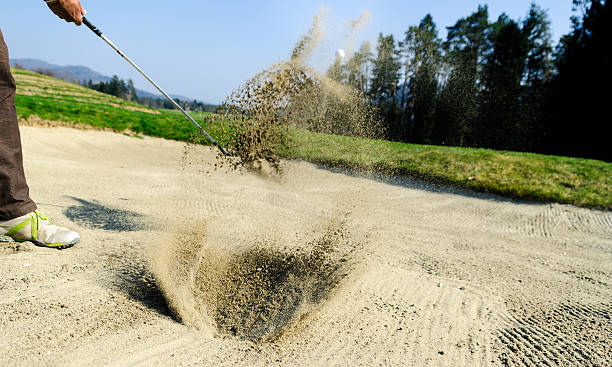 istock Golfer hitting out of a sand trap. The golf course 474407340