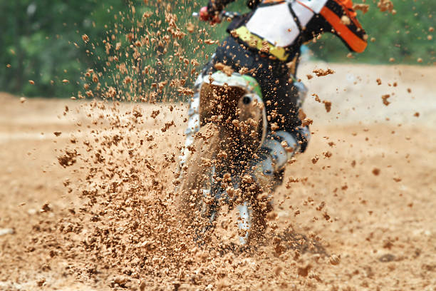 istock Mud debris flying from a motocross race 474410022