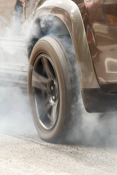 istock Suv car burns rubber off tires in the race 474410030