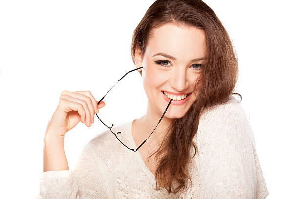 istock shy woman with glasses 474410238