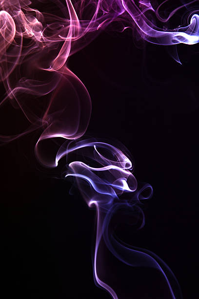 istock Colorful smoke abstract curly on black background 474410731