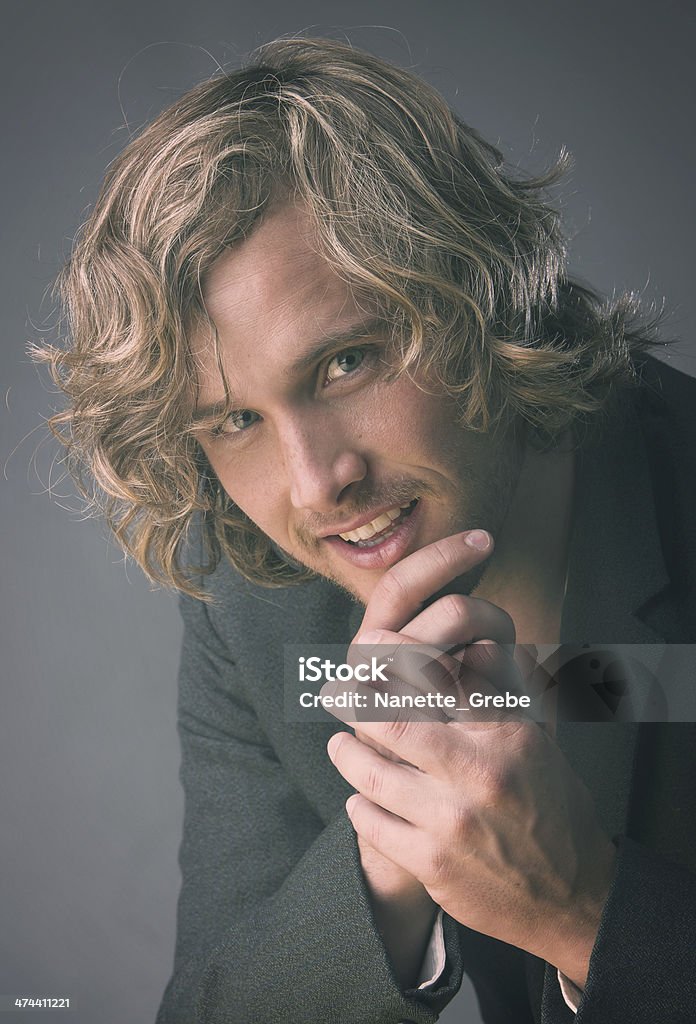 Handsome caucasian man Portrait of a handsome caucasian man wearing a white buttoned shirt and a grey jacket. Adult Stock Photo