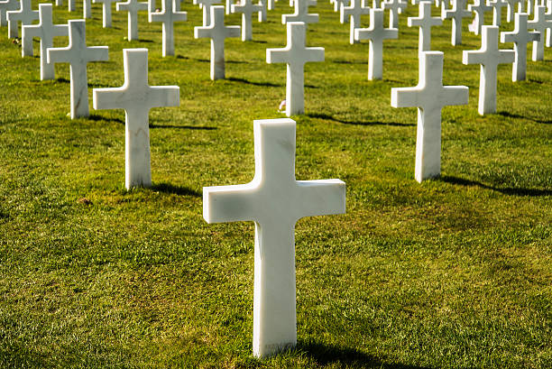 Crosses Crosses on american cemetery near Omaha Beach, in Colleville sur Mer, Normandy, France national cemetery stock pictures, royalty-free photos & images