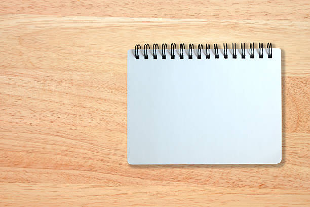 istock white page of notebook on wood texture 474413532