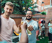 Men Toasting At Barbecue Party.