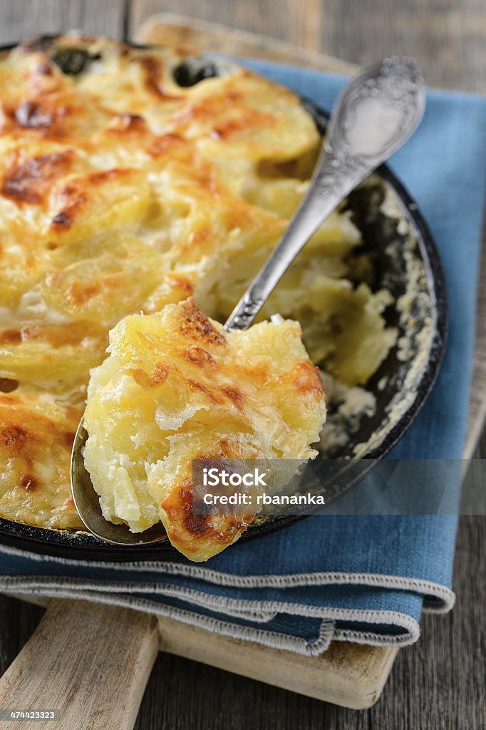 Potato gratin with cream and cheese Potato casserole with cream and cheese closeup Baked Stock Photo