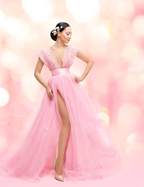 Woman Beauty Portrait Pink Dress, Sakura Flower, Asian Fashion Gown Woman Beauty Portrait in Pink Dress with Sakura Flower, Asian Girl Fashion Gown, Beautiful Model over Unfocused Background pink gown stock pictures, royalty-free photos & images