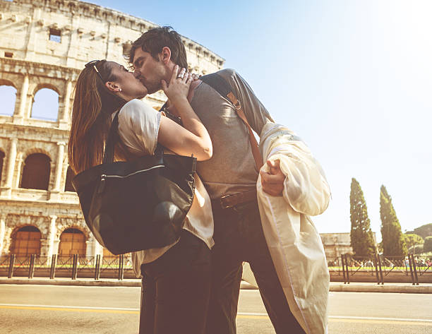 istock Passionate kiss in front of the Coliseum 474427236