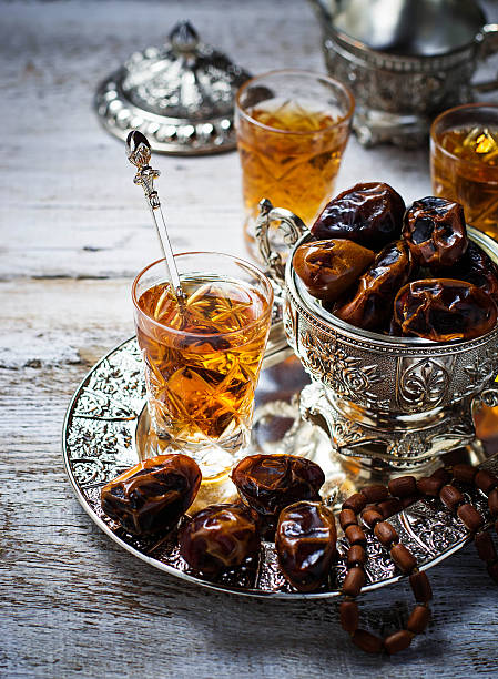 istock Traditional arabic tea and dry dates 474427370
