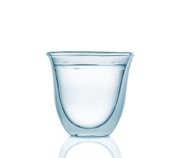 istock Glass with carbonated water on blue gradient background 474427532