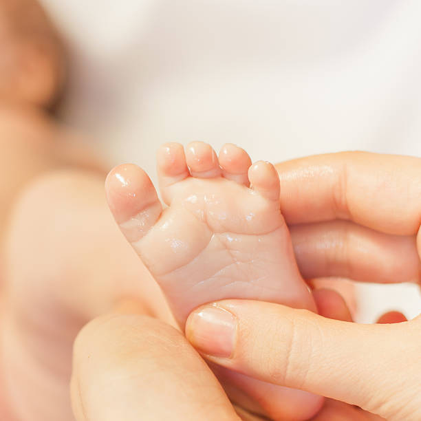istock Mother makes massage for newborn baby 474429200