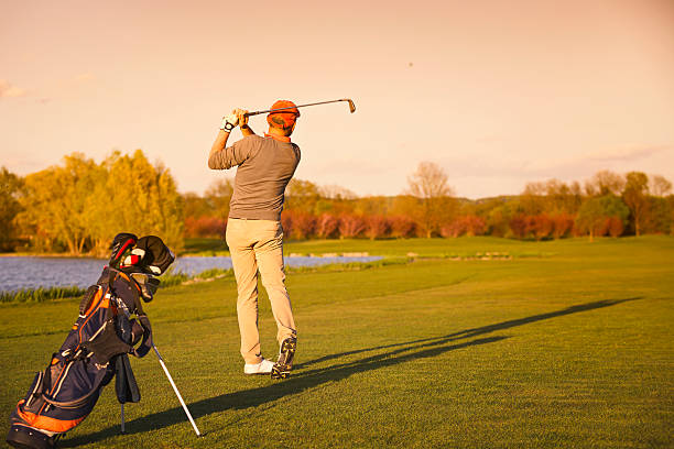 istock Golfer on fairway in evening. 474429614