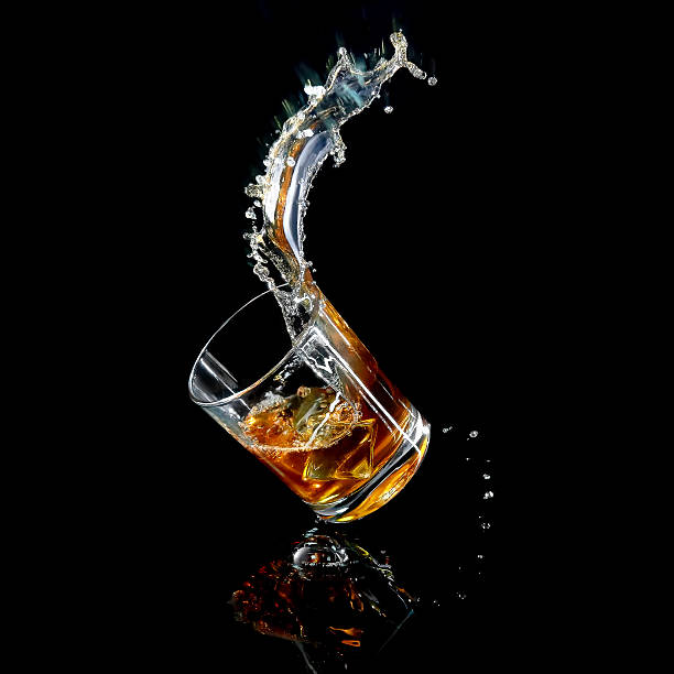 istock Splash and glass on the black background 474430118