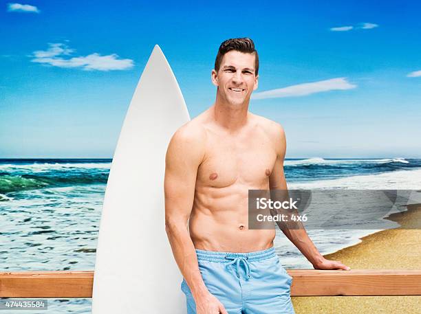 Man Standing At Beach Stock Photo - Download Image Now - 2015, Adult, Adults Only