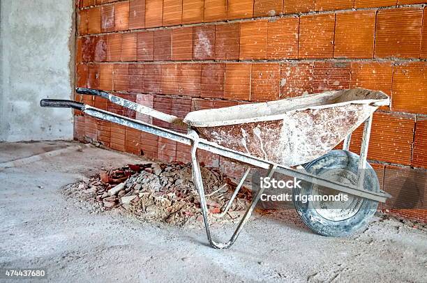 Wheelbarrow In Workplace Stock Photo - Download Image Now - 2015, Backgrounds, Brick