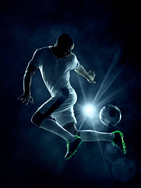 istock Soccer player dribblring a ball 474440599