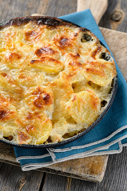 Potato baked with cream and cheese stock photo