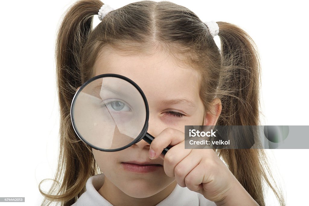 Girl with magnifying glass Girl holds in his hand a magnifying glass Child Stock Photo