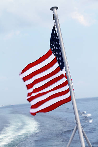 istock American flag on back of boat in wind 474446515