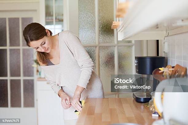 Young Woman Doing Housework Cleaning The Kitchen Stock Photo - Download Image Now - Clean, Cleaning, Kitchen