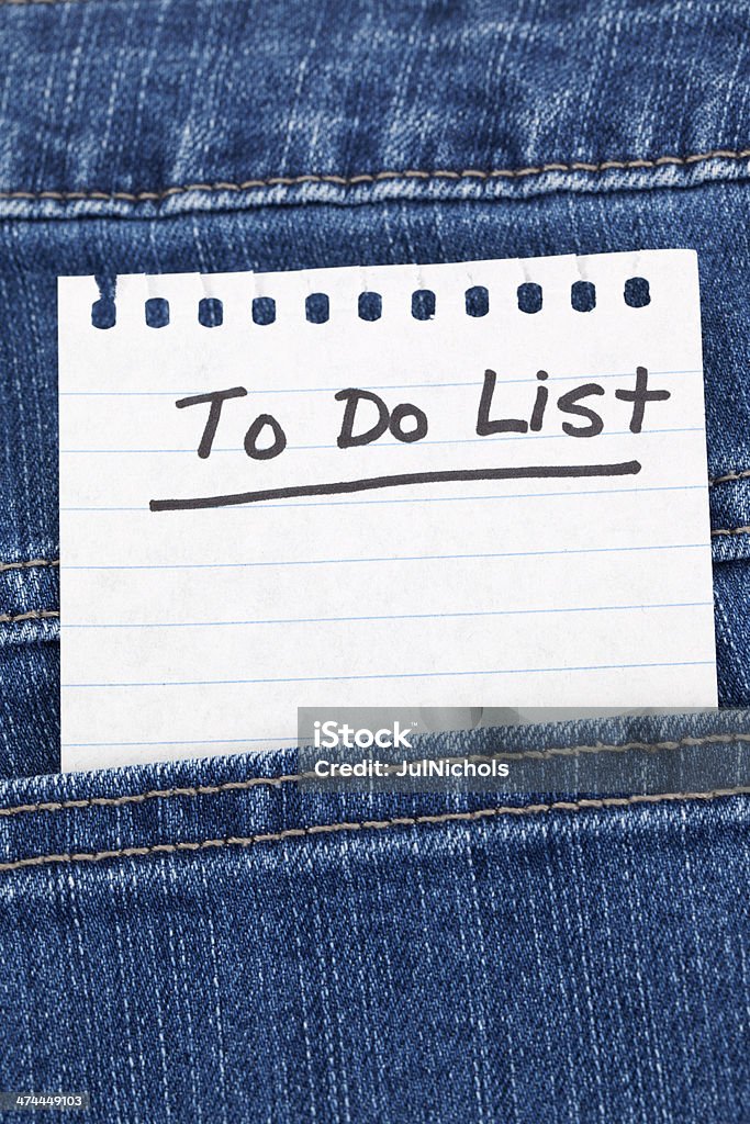 To Do List in Denim Pocket To Do List in denim jeans pocket. Adhesive Note Stock Photo