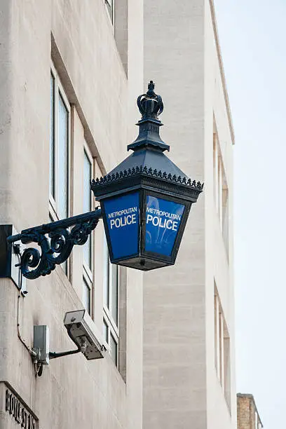 Close-up of a traditional police lantern, on display outside a metropolitan police station in the center of London, England.