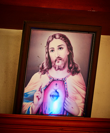 Typical Generic Catholic Image Of Jesus Christ On The Wall. Taken on the Tourist Houseboat in Kerala backwaters, India. No copyright, mass product.